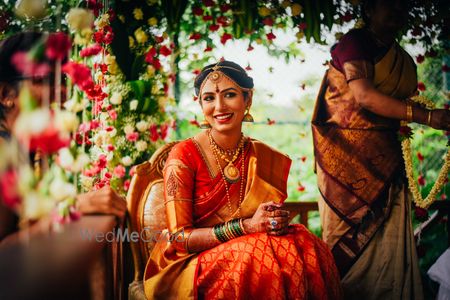 Photo of South Indian bride in orange saree