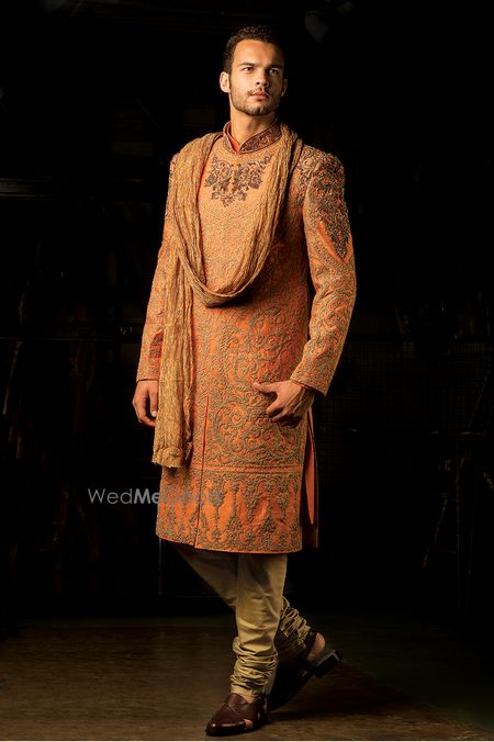 Photo of Orange embroidered sherwani for groom