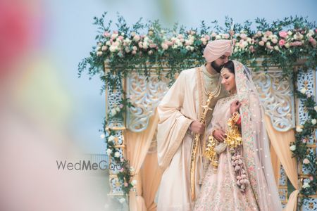 Photo of A couple coordinating in light pink outfits