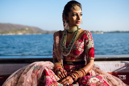 Photo of Bride wearing Sabyasachi floral lehenga.