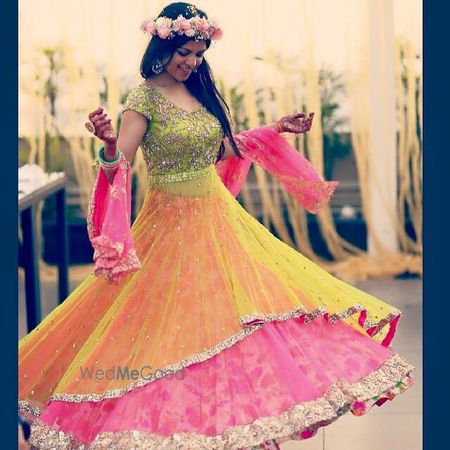 Photo of green yellow and pink layered lehenga