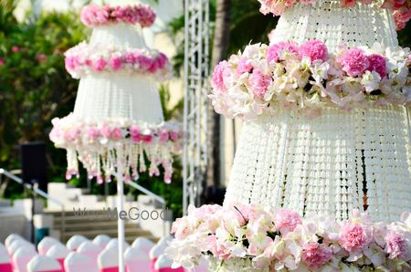 Photo of White and light pink decorated parasols in decor