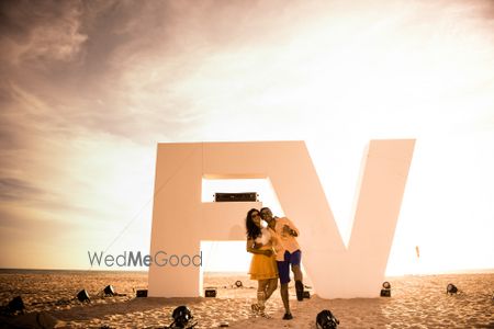 Photo of Beach pre wedding shoot with monograms