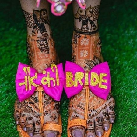 Photo of A bride flaunting her quirky footwear on her mehndi