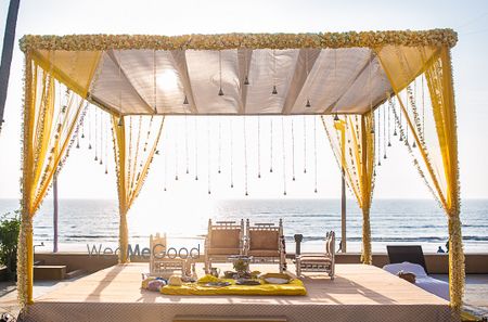 Photo of Yellow Theme Open Air Mandap Next to Beach