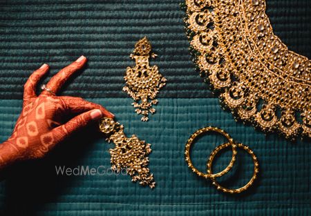 Photo of gold bridal jewellery photography idea