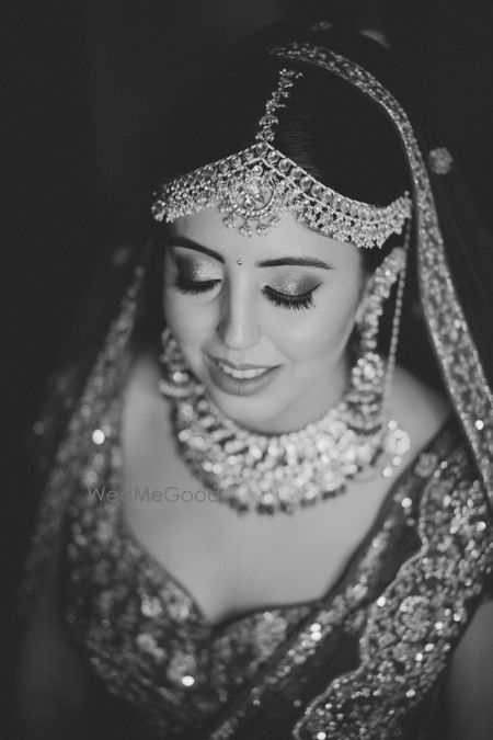 Photo of Black and white bridal portrait with eyes closed