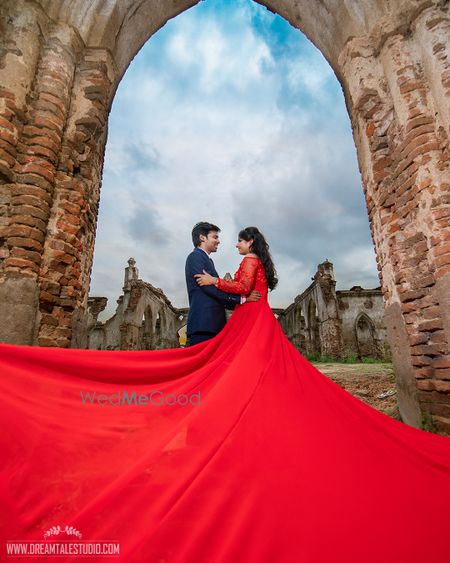 Photo of A couple poses for an outdoor pre wedding shoot