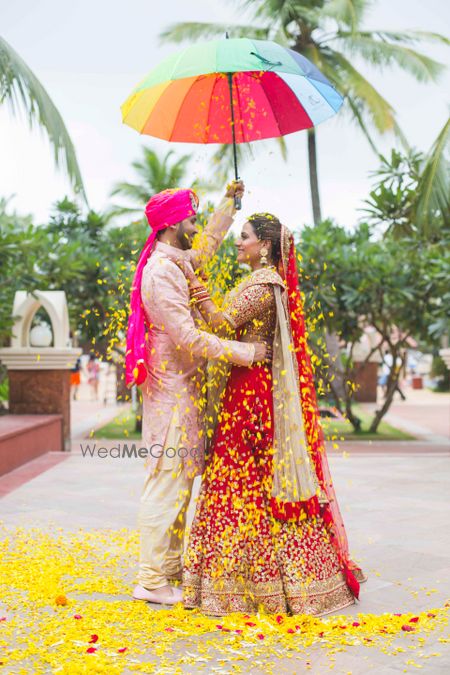 Photo of Couple Portrait with Umbrella and Petals