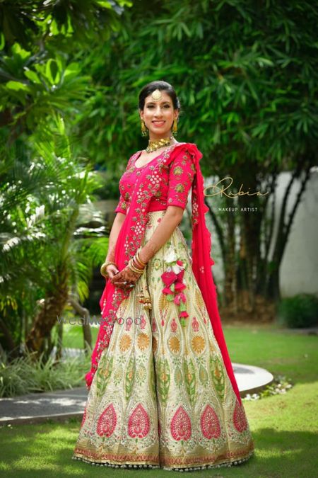 Photo of Red and green mehendi lehenga with tassels