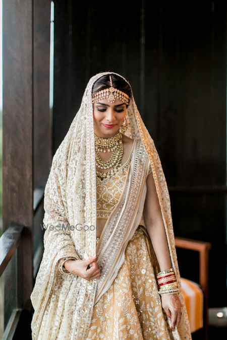 Photo of Bride in white lehenga