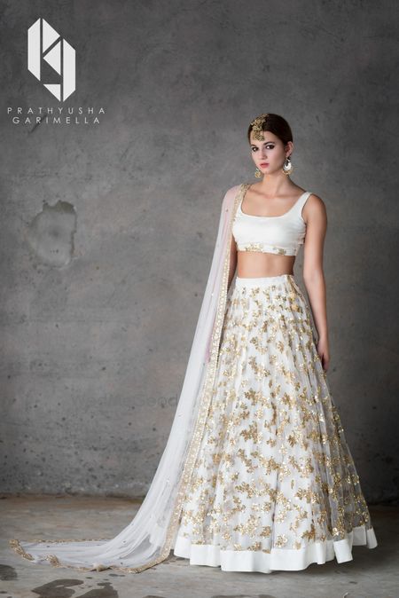 Photo of White and gold lehenga