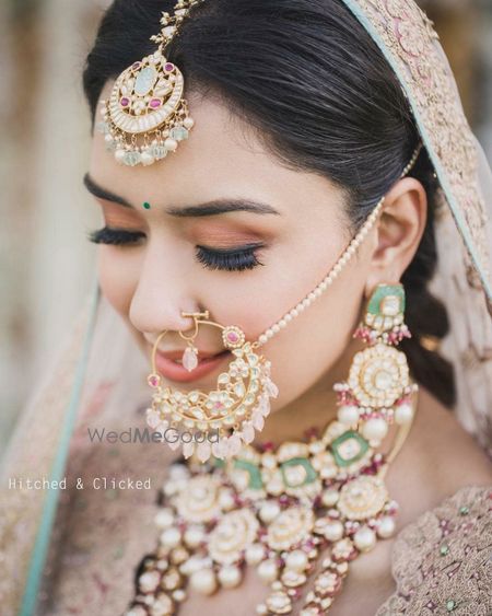 Photo of bridal jewellery with enamel work and unique nath