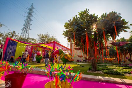 Photo of pink and yellow theme mehendi decor