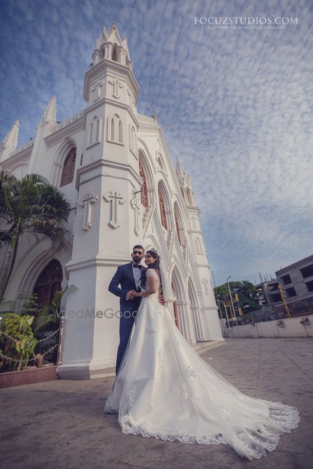 Photo of white christian brial gown with a trail