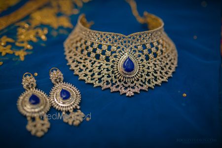 Photo of gold bridal choker necklace and earrings