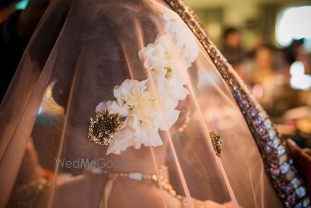 Photo of Bridal bun with white flowers