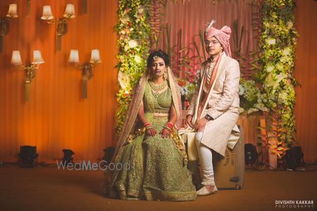 Photo of Contrasting bride and groom outfits in post wedding shoot