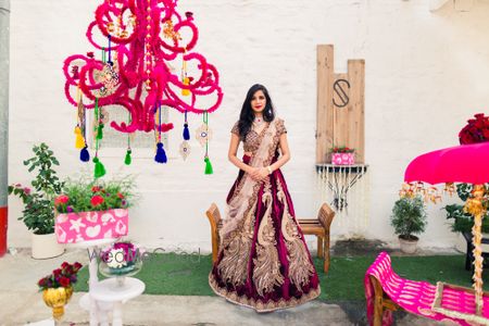 Photo of gold and maroon bridal lehenga