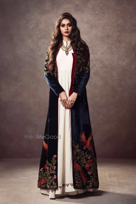 Photo of royal blue velvet jacket with off white anarkali