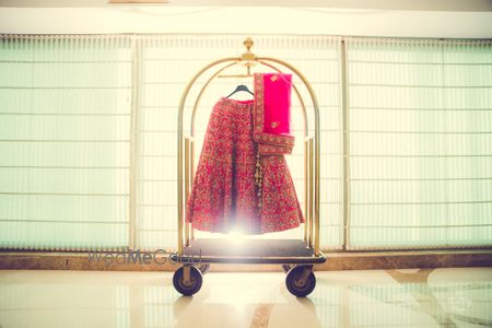 Photo of Lehenga on hanger at hotel trolley