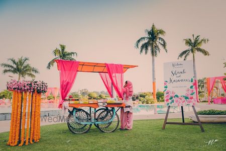 Photo of Cart in mehendi decor on entrance