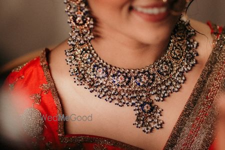 Photo of simple bridal jewellery with enamel work necklace