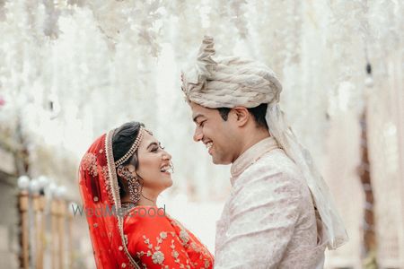 Photo of bright and happy couple shot against white background