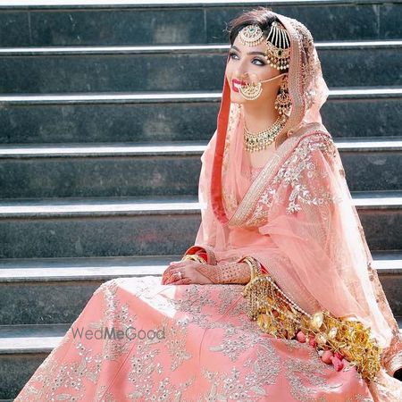 Photo of Pakistani bridal look with jewellery and dupatta draping style