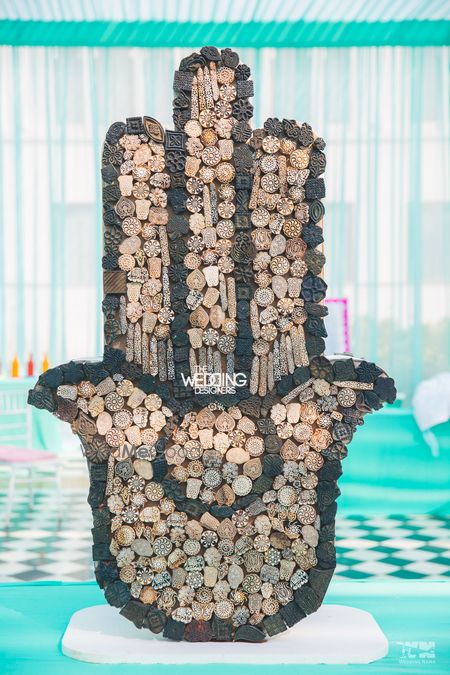 Photo of Unique mehendi decor idea with wooden block prop