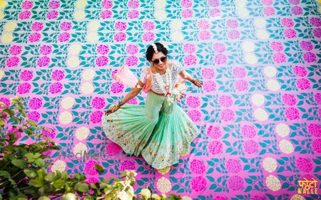 Photo of Mehendi decor idea with floral printed dance floor