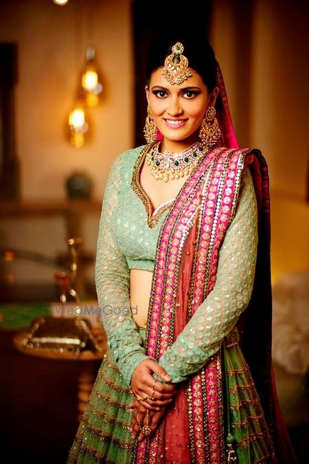 Photo of Mint green bridal lehenga with red dupatta for offbeat bride