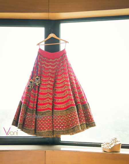 Photo of Red chevron lehenga on hanger