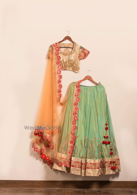 Photo of sea green and gold lehenga