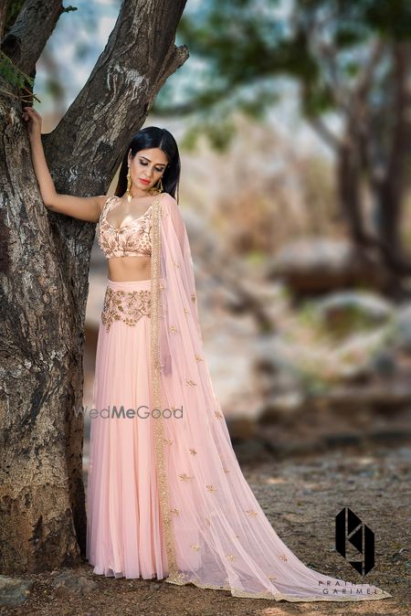 Photo of Peach and gold light lehenga