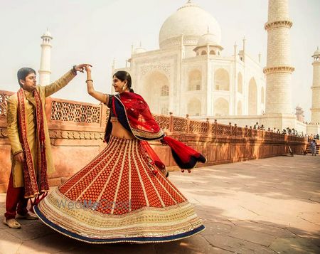 Photo of red banarsi lehenga with blue border