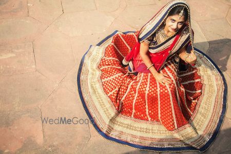 Photo of red banarsi lehenga with blue border