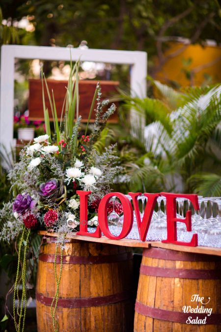 Photo of LOVE decor with floral arrangements