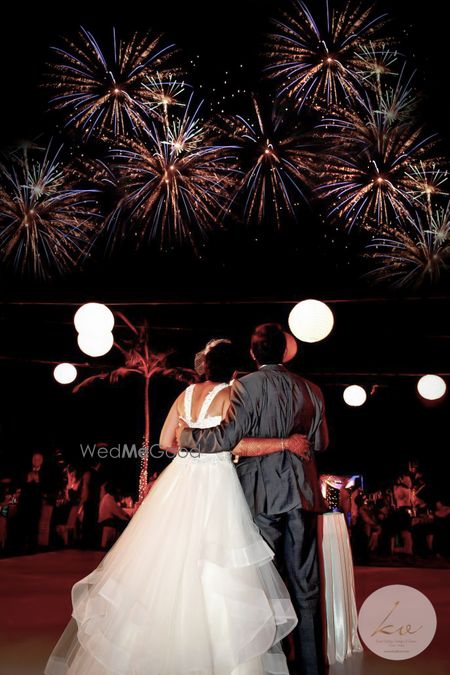 Photo of A Christain couple watches crackers in the sky.