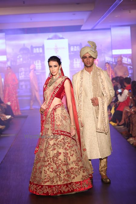 Photo of red and beige bridal lehenga