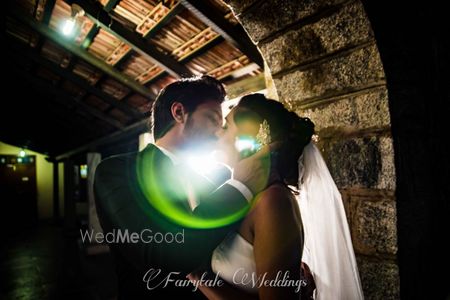 Photo of Couple kissing portrait with lens flare