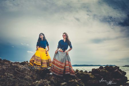 Photo of Bride with bridesmaid on pre wedding shoot in fusion wear