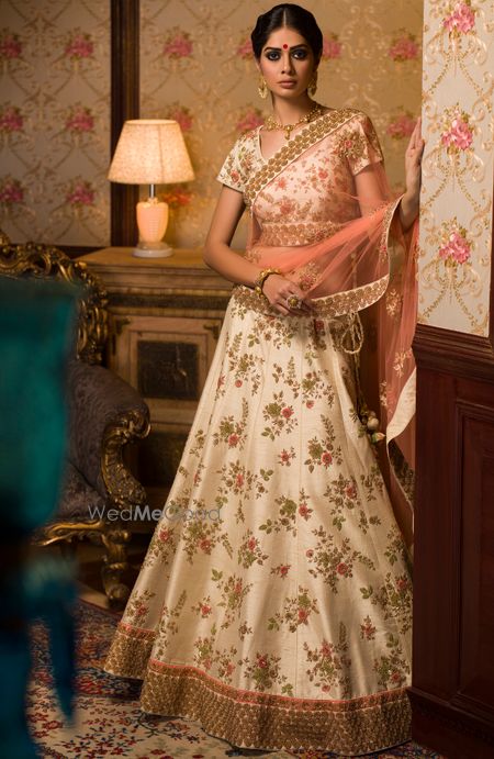 Photo of White floral lehenga with gold borders and peach dupatta for mehendi