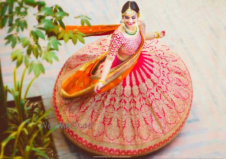 Photo of Stunning twirling bride top shot