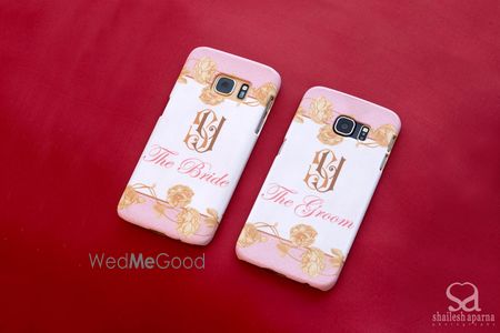 Photo of Bride and groom phone covers in white and light pink