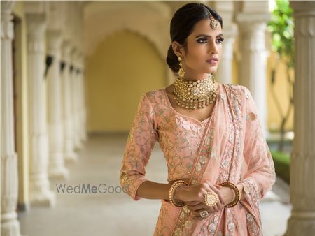 Photo of Light pink lehenga with pop of blue