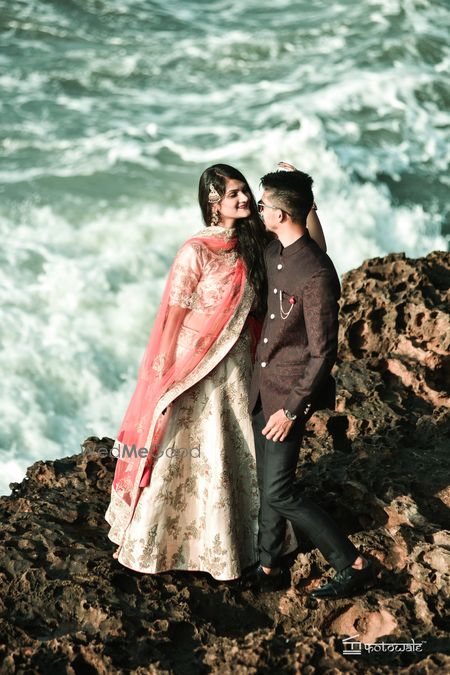 Photo of Seaside couple portrait by the water