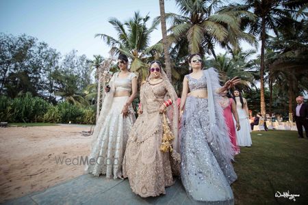 Photo of Bride and sisters in pastel outfits