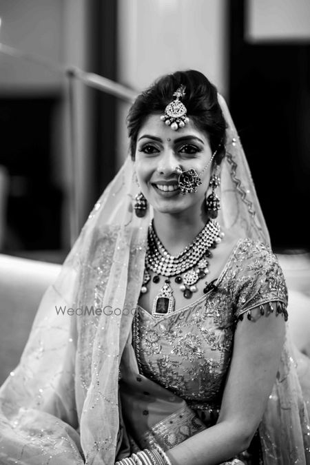 Photo of Black and white bridal portrait with unique jewellery