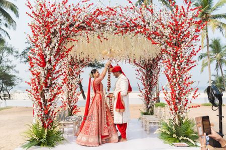 Photo of Gorgeous white and ivory open mandap for a beach side wedding